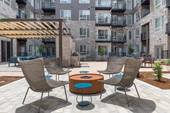 Social courtyard with seating, grill & fire pits